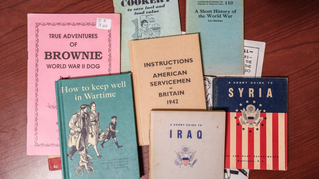 War pamphlets scattered on a desk