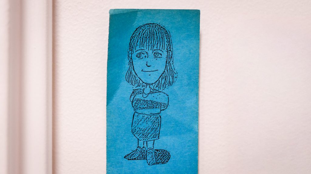 A sketch of Anne Fernald on a blue paper