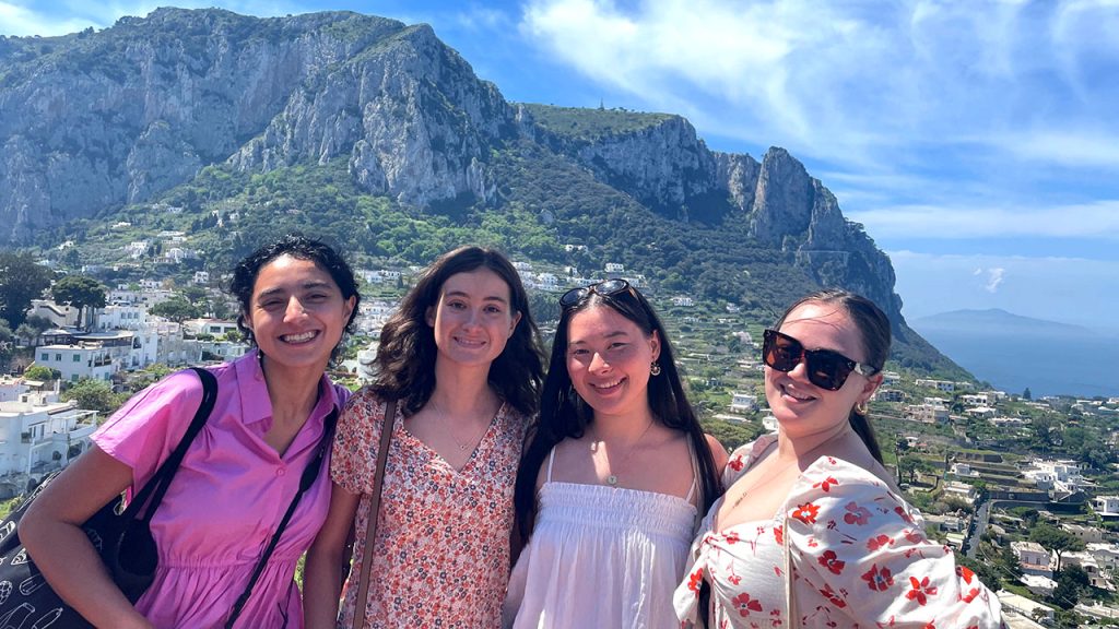 Four women standing in front of a mountain