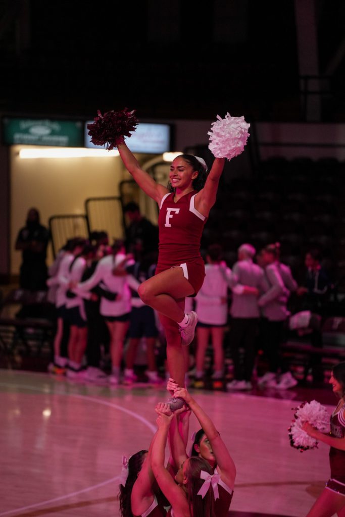 Fordham Cheerleader Allison Julve cheers at a game
