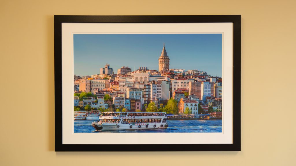 A framed photo of Istanbul hanging on the wall